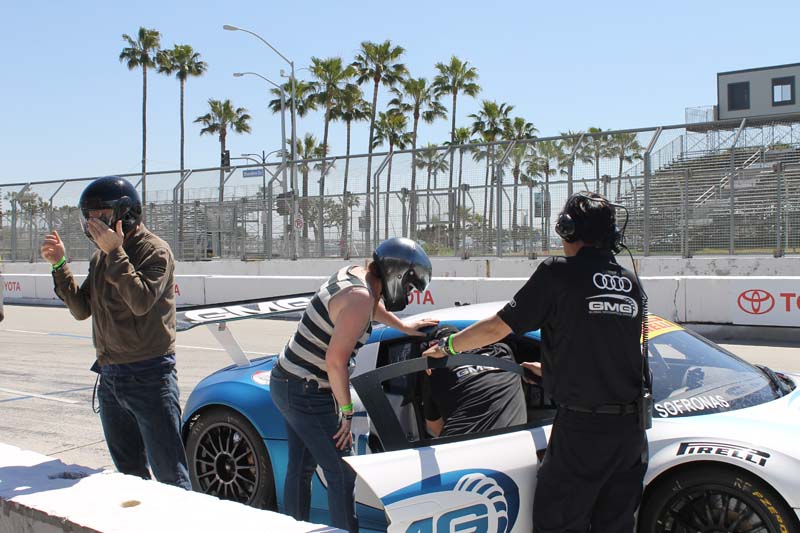 The dazed members of the media try their best to get in and out of the Audi.